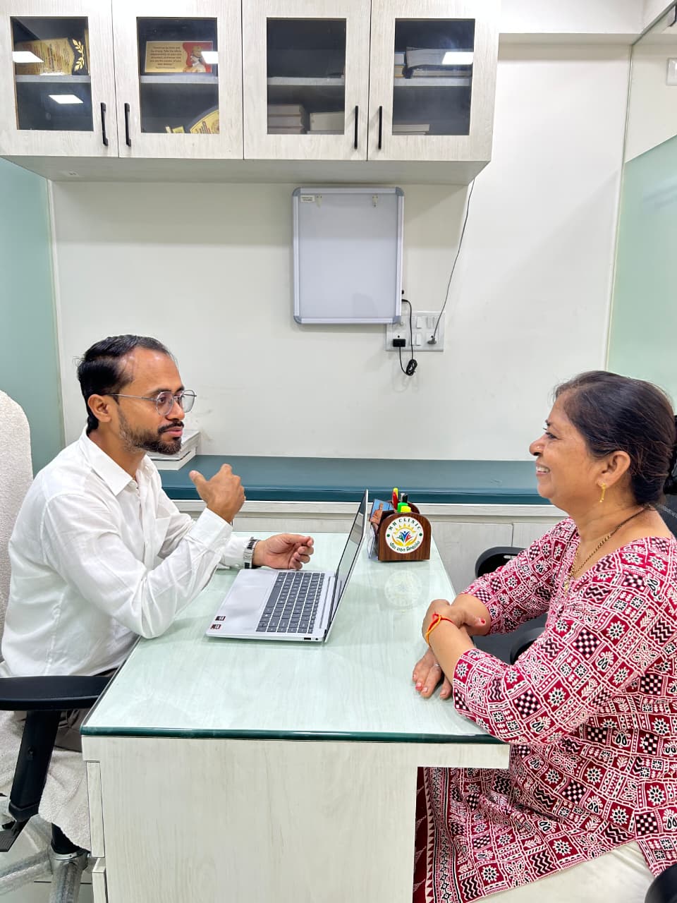 Warm clinic interior with treatment table and natural light